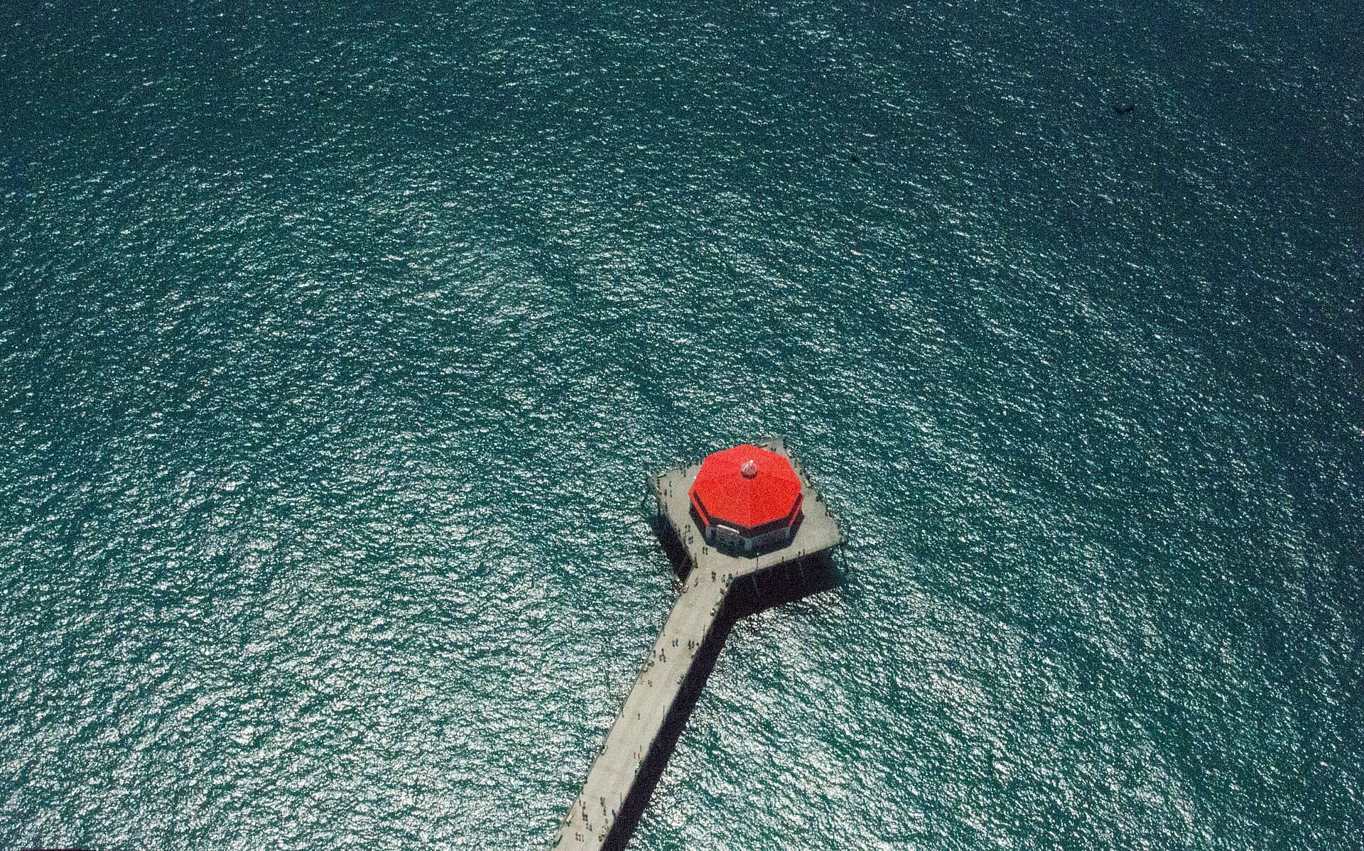 Aerial view of the Huntington Beach pier reaching into the Pacific